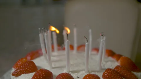 MACRO: Unrecognizable person blows out candles on their delicious birthday cake. Stock Footage 138632916
