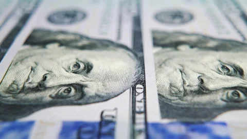 Macro of US hundred dollar bills lying in row Stock Footage 132003405