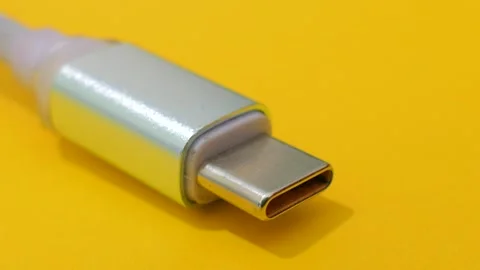 Macro USB-C Charging Cable Connector on Yellow Background Stock Footage 330398158