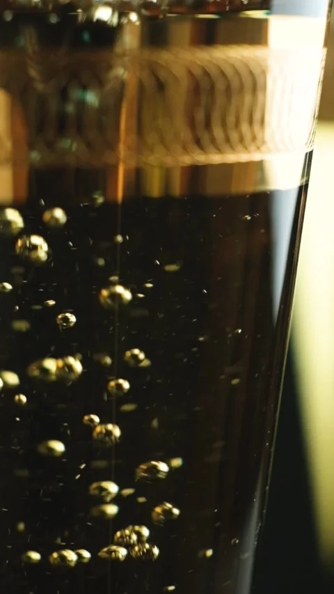 Macro vertical shooting of white wine in glass, bubbles slow motion Stock Footage 329550211
