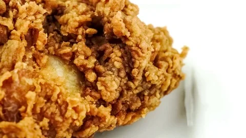 Macro video of appetizing fried chicken on white background Stock Footage 83482553