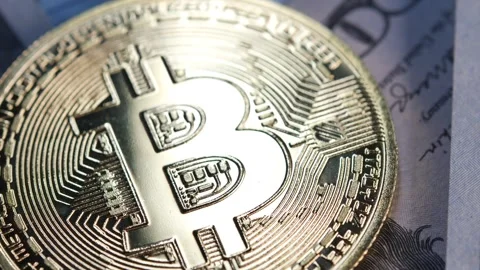 Macro video of Bitcoin coin and dollar and euro bills. Stock Footage 271870941