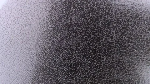 Macro video of black artificial leather with a special print in the form of scal Stock Footage 142493601
