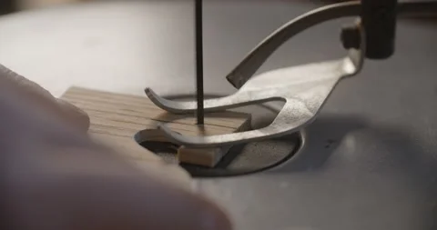 Macro video: carpenter uses automatic jigsaw and cuts small plywood parts Video stock 149761818