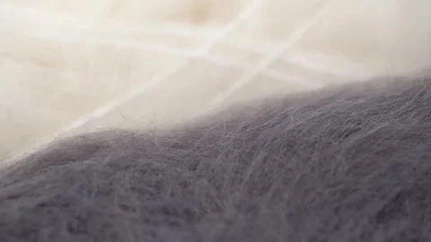Macro video fluffy yarn in gray and white colors for knitting. closeup rotation. Stock Footage 255687352