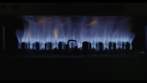 Macro video of a gas burner heating up in the dark Stock Footage 301666836