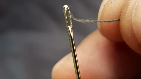 Macro video of hand threading a needle Video stock 310464486
