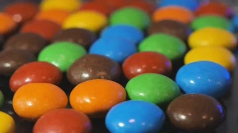Macro video of a heap of multi-colored dragees and sweets Stock Footage 184474674