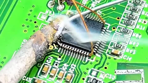 Macro Video of IC Desoldering Process on Motherboard Stock Footage 333503810