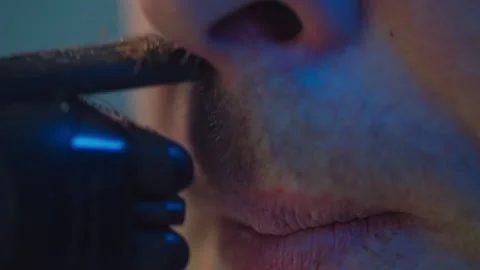 Macro video of a man shaving a mustache with a trimmer. Stock Footage 289729211