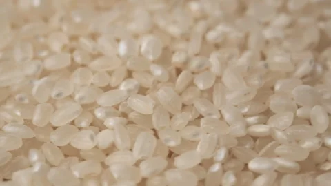 Macro video of many rice grains rotating in circle. Asian food. Eco food concept Stock Footage 284616452