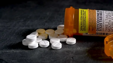 Macro video of Oxycodone Opioid tablets on slate table Stock-Footage 81447850