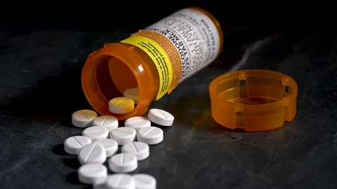 Macro video of Oxycodone Opioid tablets on slate table Stock Footage 81449408