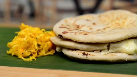 Macro video pans across a typical Central American deli named 'Pupusas,' sh.. Video stock 252339438