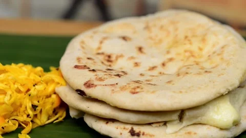 Macro video pans across a typical Central American deli named 'Pupusas,' sh.. Video stock 252339665