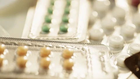Macro video of pills in a blister pack. Video stock 278831900