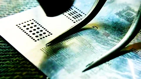 Macro Video of Professional Mobile IC Reballing Stock Footage 332800960