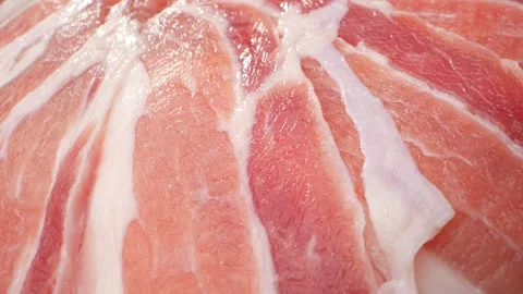 Macro video of raw pork belly slice Stock Footage 245714894
