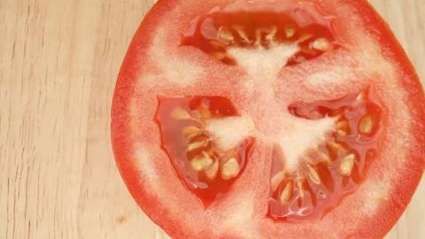 Macro video showcases a half tomato Stock Footage 244062690