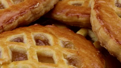 Macro video of small delicious apple pies  Stock Footage 261594801