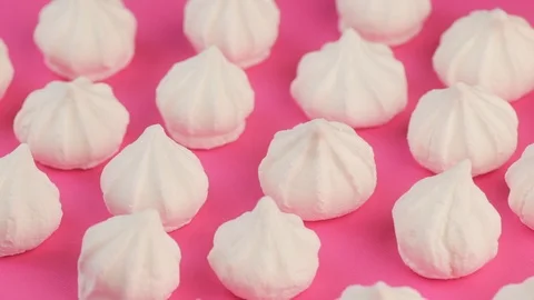 Macro Video of Soft, Fluffy, White Marshmallows on Pink Background. Видео 87833974