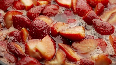 Macro Video of Strawberry Jam Making on Gas Stove Stock Footage 241246549