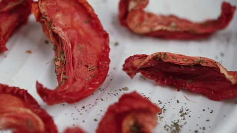 Macro video of sun dried tomatoes on white tray of electric dryer for vegetables Stock Footage 253719011