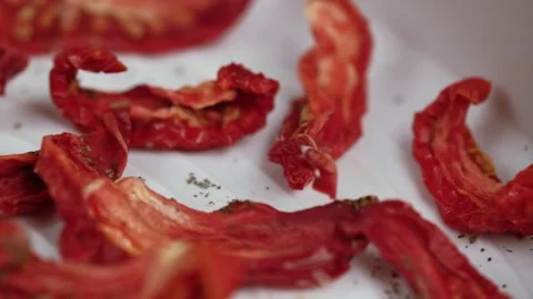 Macro video sun dried tomatoes on white plastic tray an electric dryer. Stock Footage 278319834