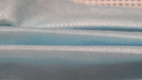 Macro Video Of Surgical Mask In Plain White Light Video stock 141543892