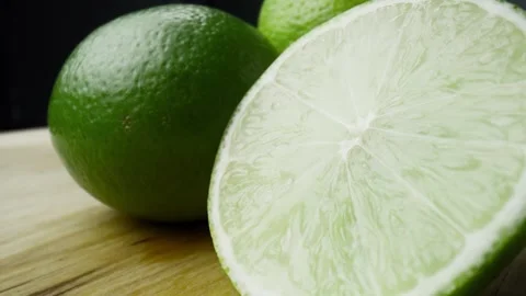 Macro video of water drop falling off the lime. Stock-Footage 242589078