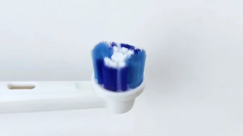 Macro video of a working electric toothbrush. Close-up shows the nozzle head, th Stock-Footage 124946809