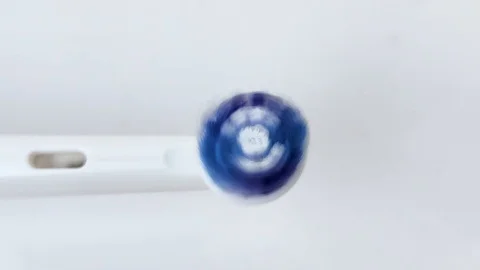 Macro video of a working electric toothbrush. Close-up shows the nozzle head, th Stock Footage 124946817