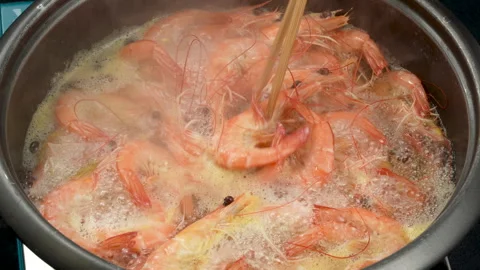 Macro of Vietnamese Whiteleg Shrimp in Bubbling Boiling Water Pot Stock Footage 339634896