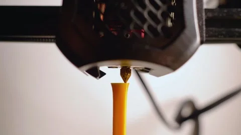 Macro View of a 3D Printer Manufacturing a Yellow Plastic Detail 库存影片 252079251