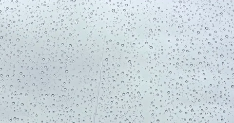 Macro view of abstract storm rain water drops falling down on window. Selective 動画素材 131306997
