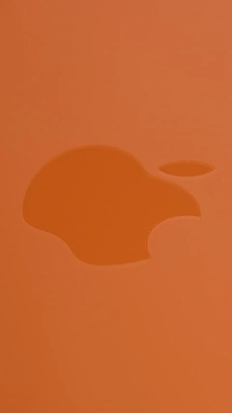 Macro View of Apple Logo on Back of iPhone 17 Pro in Cosmic Orange Color with Stock Footage 318056903