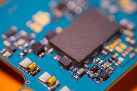 Macro view of black processor chip and electronic components mounted on a b.. Stock Photos