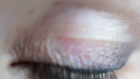 Macro view blinking woman green colored eye Stock Footage 117112355