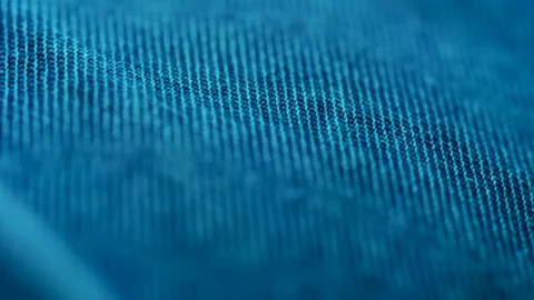 Macro view of blue denim fabric showing deep indigo textile weave pattern w.. Stock Footage 339464721