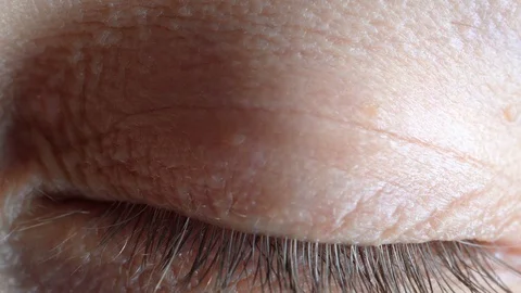 Macro view of a blue eye that opens. Stock Footage 127801503