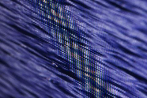 Macro view of a blue pixelated screen display revealing RGB pixels 库存照片