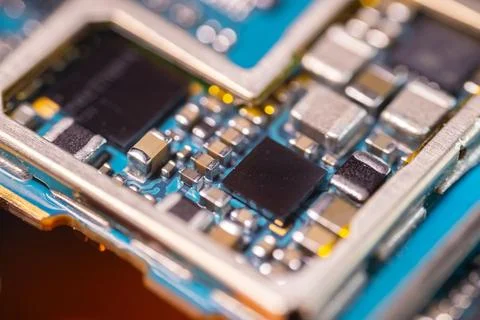 Macro view of blue printed circuit board with black integrated chips, silve.. Stock-Fotos
