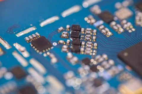 Macro view of blue printed circuit board with integrated chips, electronic .. Stock Photos
