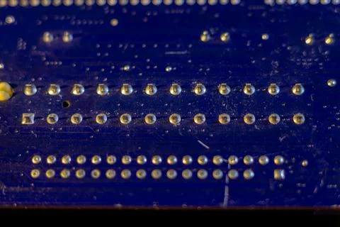 Macro view of blue semiconductor hardware showing technical details of micro Stock Photos