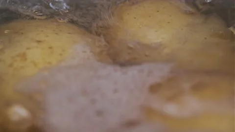 Macro View of Boiling Potatoes with Water in a Pan Stock Footage 145680770