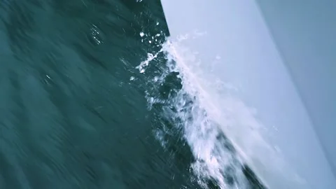 Macro view on the bow of a fast moving sailboat in the ocean on sunny day. Stock Footage 136454414