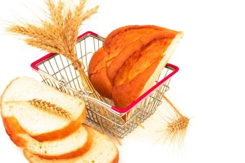 Macro view of bread, bun, sliced loaf, baguette and ears in metal shopping ba Stock Photos