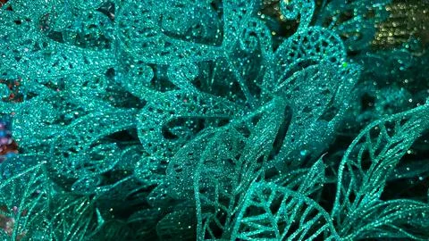 Macro view of bright teal glitter openwork decoration. Festive holiday abst.. Foto stock