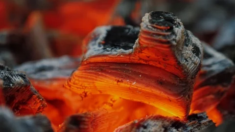 Macro view of burning orange charcoal in campfire Stock Footage 120602743