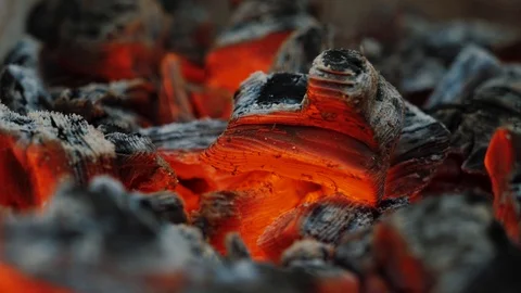 Macro view of burning orange charcoal in campfire Video stock 120602783